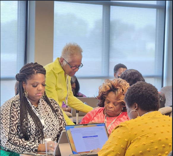 Dr. Cassondra Corbin-Thaddies supporting participants during a collaborative professional learning session,